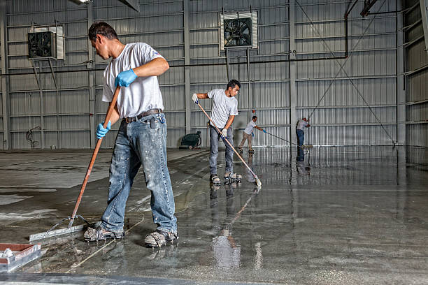 contractors applying epoxy coating on gym floor in Litchfield County, CT
