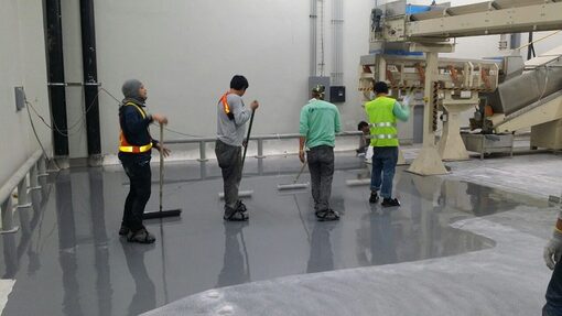 epoxy flooring contractors working to finish  a floor in Winchester, CT